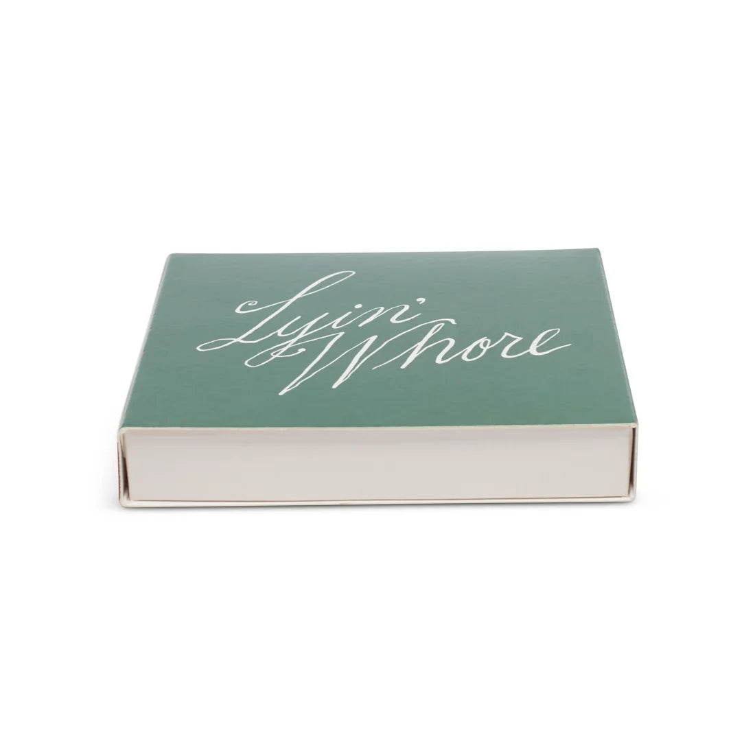 Green square matchbox, low side view showing the Lyin' Whore script and white tray edge