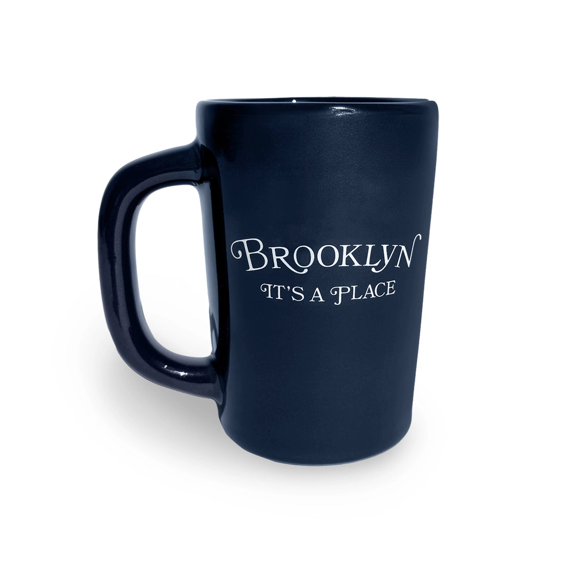 Navy blue ceramic mug with white Brooklyn It's A Place lettering, front view