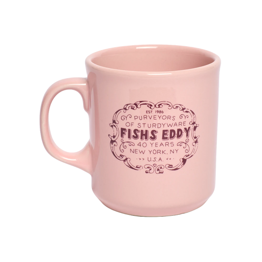 FE 40th Anniversary Mug - Pink ceramic drinkware, with a clean, polished finish and distinctive shape or artwork; a comfortable everyday choice for coffee, tea, cocoa, or desk-side sipping. Alternate product view shows more of the shape, finish, and design details.