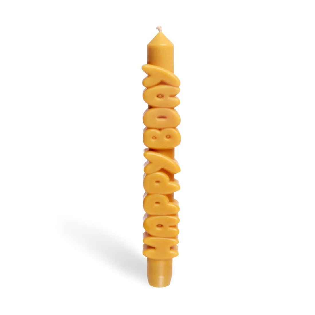 Mustard yellow taper candle with HAPPY BDAY spelled out in stacked sculpted letters