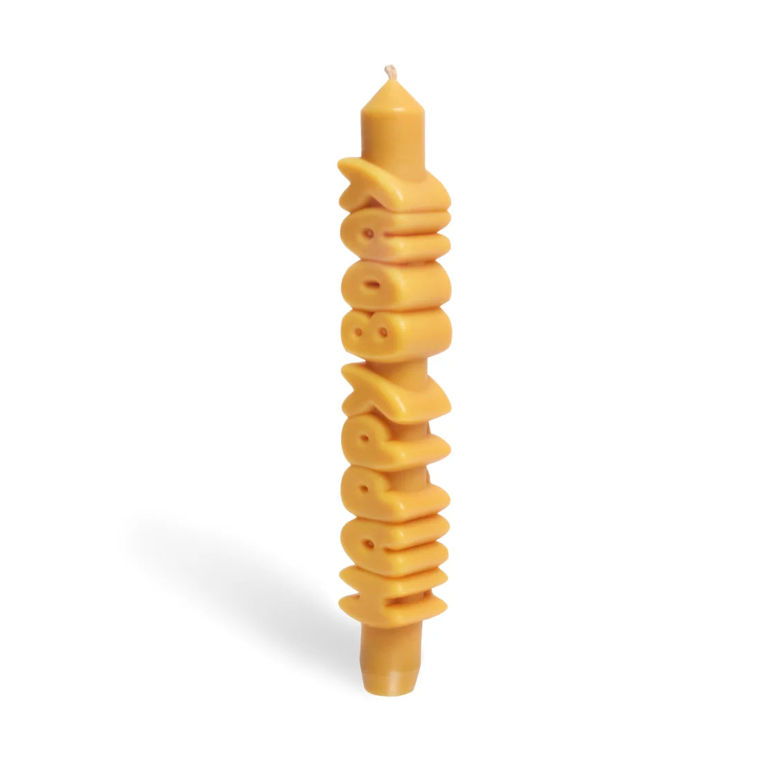 Yellow Happy Bday taper candle turned slightly to show the dimensional lettering