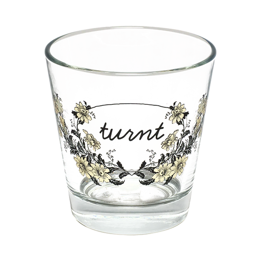 Influence - Turnt Tumbler decorative glassware, with a crisp silhouette and decorative details that stand out on the table; versatile for water, cocktails, juice, or building a more expressive glassware mix. Alternate product view shows more of the shape, finish, and design details.