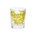 Clear mini lowball glass with a retro band of yellow flowers and green leaves
