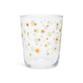 Clear juice glass with a scattered print of small white and yellow daisies
