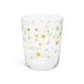 Daisies juice glass at a slight angle showing the rim and daisy print