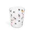 Bees juice glass from above showing the bee illustrations through the glass