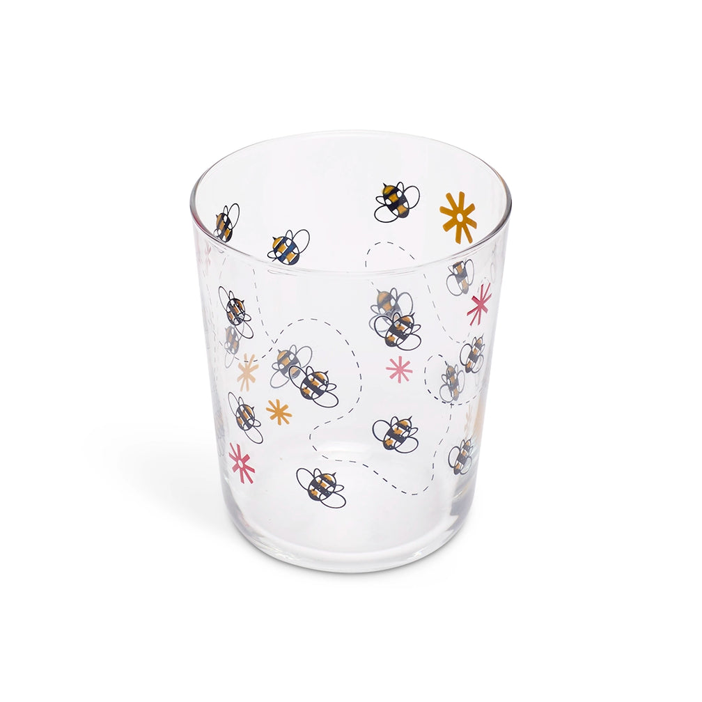 Bees juice glass from above showing the bee illustrations through the glass
