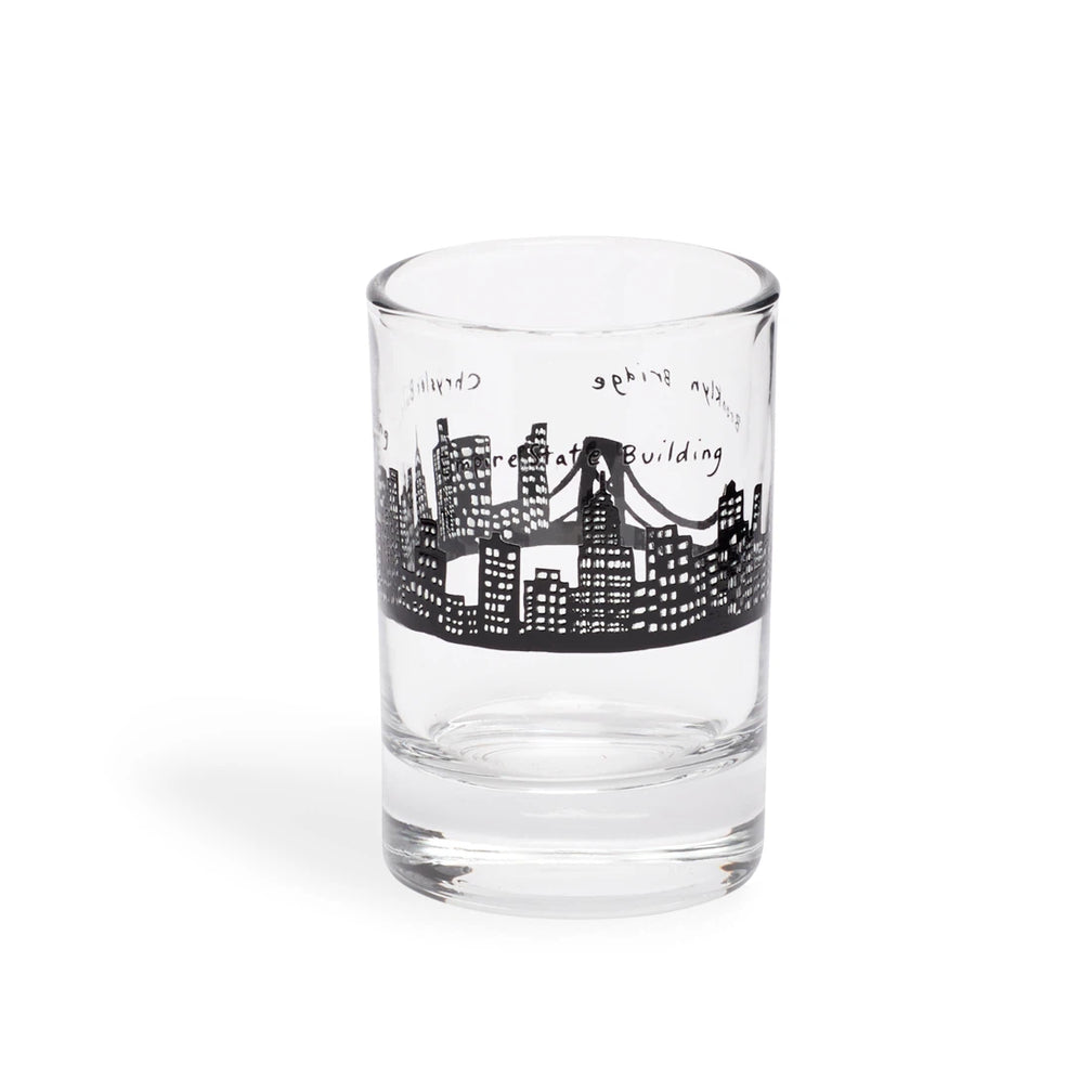 Clear shot glass with a black hand-drawn NYC skyline and Brooklyn Bridge band, side view