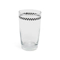 Checkerboard juice glass at a slight angle showing the rim