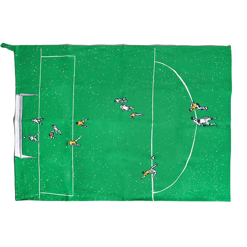 Green soccer field tea towel laid flat showing the goal box, center line and players