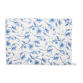 Cream wildflower tea towel laid flat with an all-over blue floral print