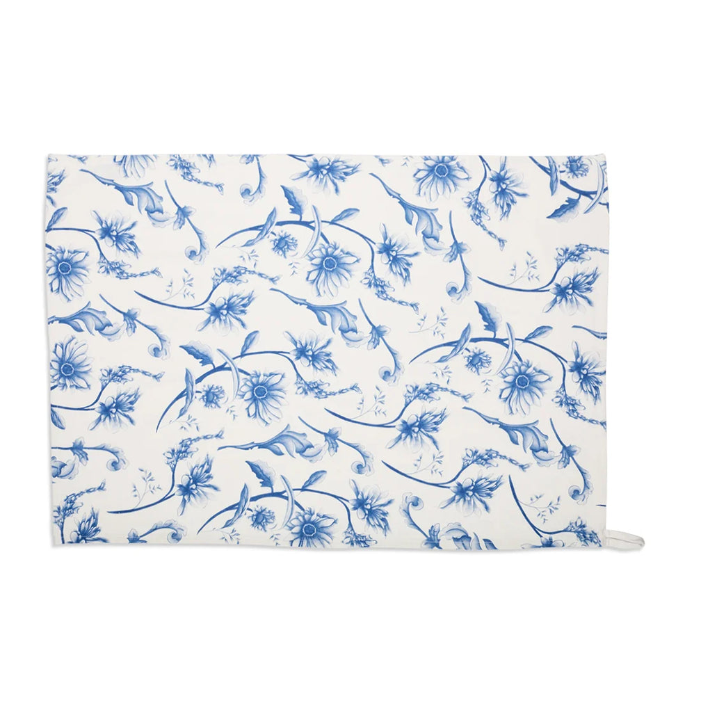 Cream wildflower tea towel laid flat with an all-over blue floral print