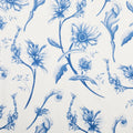 Close-up of tea towel fabric showing detailed blue vintage wildflowers on cream