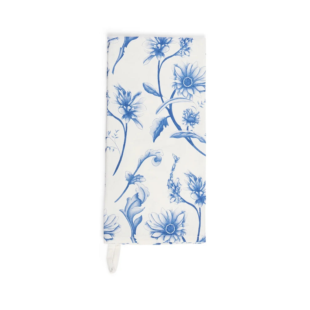 Folded cream tea towel with a blue vintage wildflower print and hanging loop