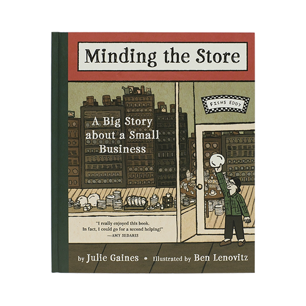 Minding the Store illustrated book, with thoughtful packaging and a design that makes it easy to use, display, or gift; a character-filled read and display piece for fans of Fishs Eddy, New York, and creative retail stories. Primary product view highlights the overall design and proportions.