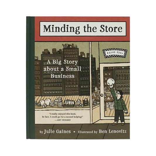 Minding the Store illustrated book, with thoughtful packaging and a design that makes it easy to use, display, or gift; a character-filled read and display piece for fans of Fishs Eddy, New York, and creative retail stories. Primary product view highlights the overall design and proportions.