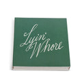 Green square matchbox from above with Lyin' Whore in white cursive script