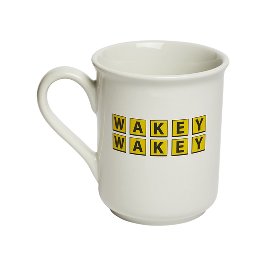 Wakey Wakey Mug ceramic drinkware, with a clean, polished finish and distinctive shape or artwork; a comfortable everyday choice for coffee, tea, cocoa, or desk-side sipping. Alternate product view shows more of the shape, finish, and design details.