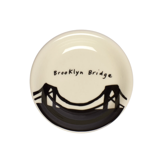 212 Skyline - Brooklyn Bridge Butter Pad serving and catchall piece, with a clean, polished finish and distinctive shape or artwork; useful for snacks and small bites, or for organizing jewelry, keys, and countertop essentials. Primary product view highlights the overall design and proportions.