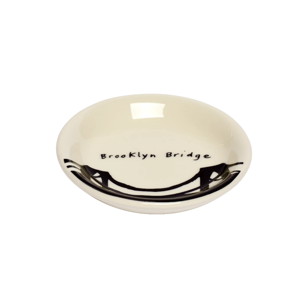 212 Skyline - Brooklyn Bridge Butter Pad serving and catchall piece, with a clean, polished finish and distinctive shape or artwork; useful for snacks and small bites, or for organizing jewelry, keys, and countertop essentials.