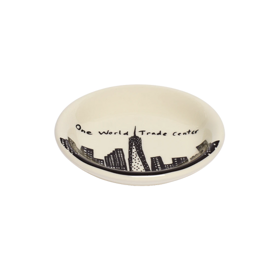 212 Skyline - One Wtc Butter Pad serving and catchall piece, with a clean, polished finish and distinctive shape or artwork; useful for snacks and small bites, or for organizing jewelry, keys, and countertop essentials. Alternate product view shows more of the shape, finish, and design details.