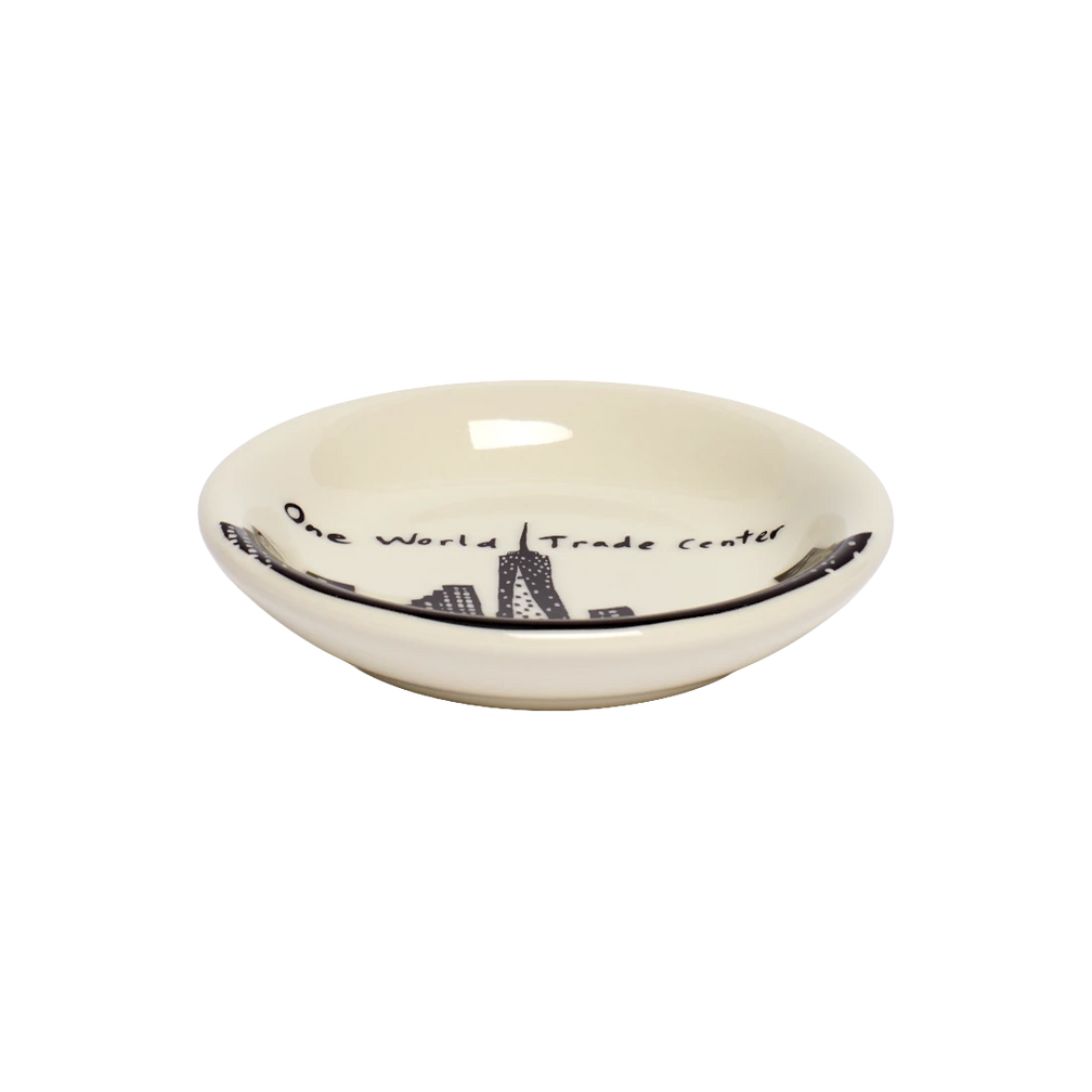 212 Skyline - One Wtc Butter Pad serving and catchall piece, with a clean, polished finish and distinctive shape or artwork; useful for snacks and small bites, or for organizing jewelry, keys, and countertop essentials. Additional view helps show the profile, scale, and decorative details.