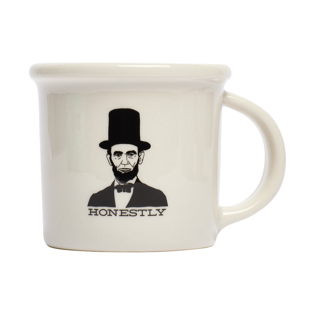 Honest Abe Mug ceramic drinkware, with a clean, polished finish and distinctive shape or artwork; a comfortable everyday choice for coffee, tea, cocoa, or desk-side sipping. Primary product view highlights the overall design and proportions.