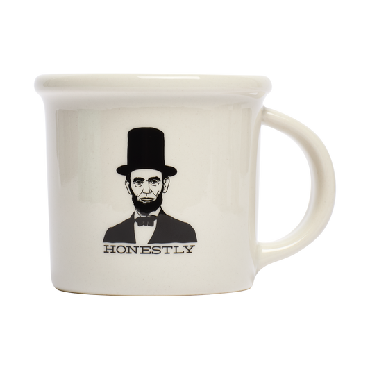 Honest Abe Mug ceramic drinkware, with a clean, polished finish and distinctive shape or artwork; a comfortable everyday choice for coffee, tea, cocoa, or desk-side sipping. Primary product view highlights the overall design and proportions.