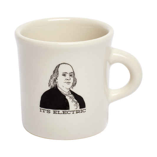 Its Electric Mug ceramic drinkware, with a clean, polished finish and distinctive shape or artwork; a comfortable everyday choice for coffee, tea, cocoa, or desk-side sipping. Alternate product view shows more of the shape, finish, and design details.