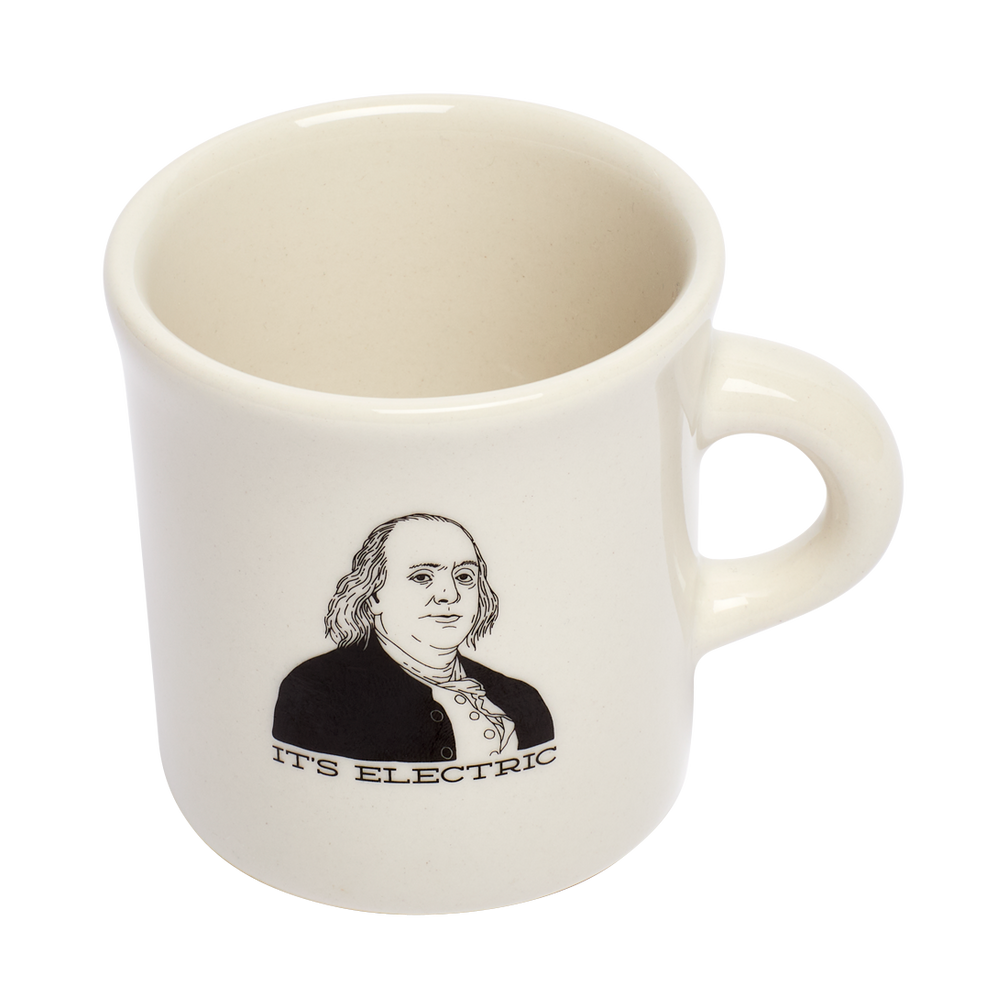 Its Electric Mug ceramic drinkware, with a clean, polished finish and distinctive shape or artwork; a comfortable everyday choice for coffee, tea, cocoa, or desk-side sipping. Additional view helps show the profile, scale, and decorative details.