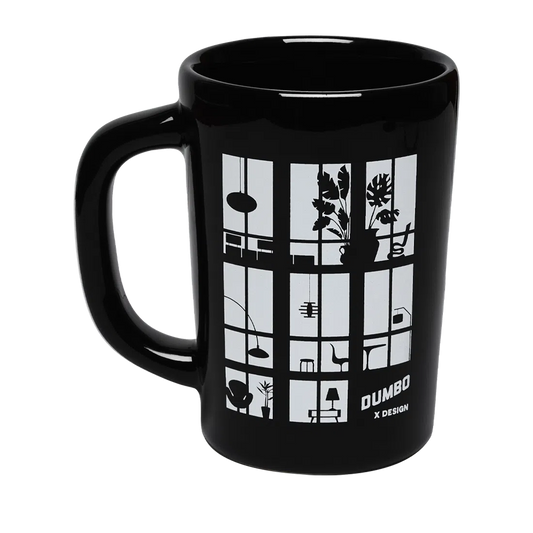Dumboxdesign Mug ceramic drinkware, with a clean, polished finish and distinctive shape or artwork; a comfortable everyday choice for coffee, tea, cocoa, or desk-side sipping. Alternate product view shows more of the shape, finish, and design details.