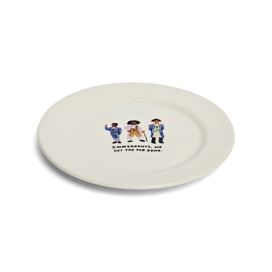 Angled view of Immigrants, We Get the Job Done ceramic dinner plate with Hamilton-inspired artwork.