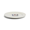 Angled view of Immigrants, We Get the Job Done ceramic dinner plate with Hamilton-inspired artwork.