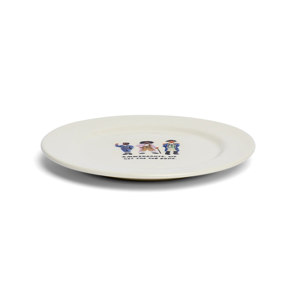 Angled view of Immigrants, We Get the Job Done ceramic dinner plate with Hamilton-inspired artwork.