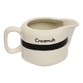 Cream pitcher with 'Creamuh' label on a white background