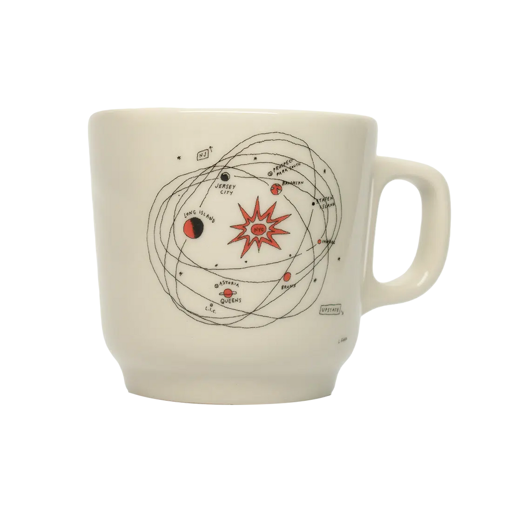 Liana Finck - Planets Mug ceramic drinkware, with a clean, polished finish and distinctive shape or artwork; a comfortable everyday choice for coffee, tea, cocoa, or desk-side sipping. Additional view helps show the profile, scale, and decorative details.
