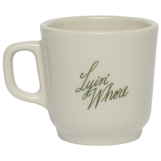 Pleasantries - Lyin Whore Mug ceramic drinkware, with a clean, polished finish and distinctive shape or artwork; a comfortable everyday choice for coffee, tea, cocoa, or desk-side sipping. Alternate product view shows more of the shape, finish, and design details.