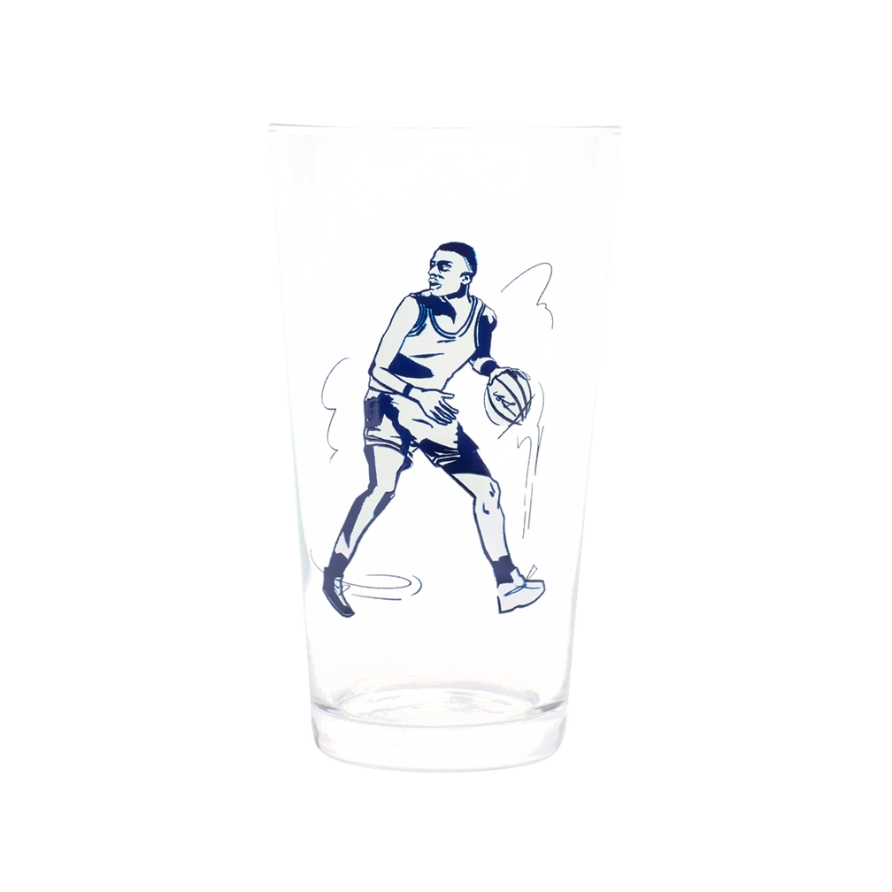 Basketball Pint Glass generous glassware, with a crisp silhouette and decorative details that stand out on the table; a practical choice for beer, soda, iced tea, or casual entertaining. Primary product view highlights the overall design and proportions.