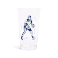 Clear pint glass with a navy illustration of a basketball player dribbling, side view